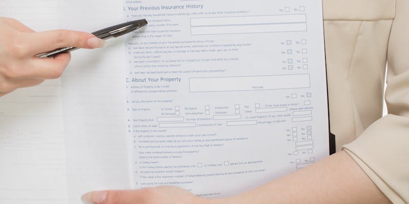 Insurance policy documents and contract paperwork for appraisal clause review
