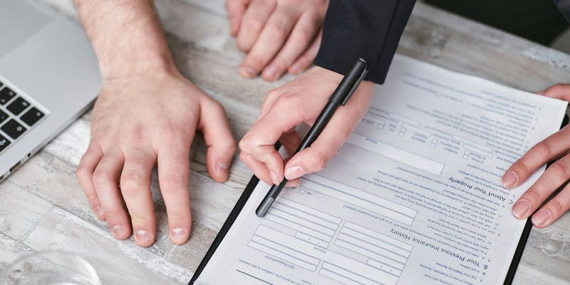 Homeowner reviewing insurance claim denial paperwork