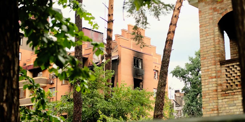 Fire and smoke damage to interior walls and ceiling of residential property requiring restoration